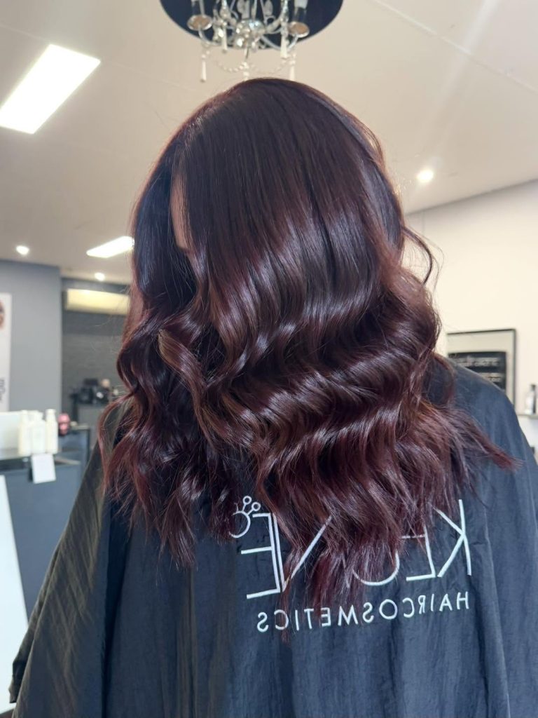 Glossy deep brunette waves styled at Hair Envy Wallacia