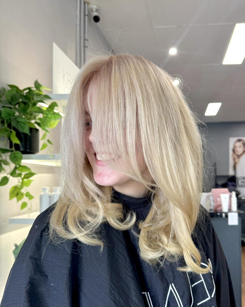 Fresh blonde layered hairstyle at Hair Envy Wallacia
