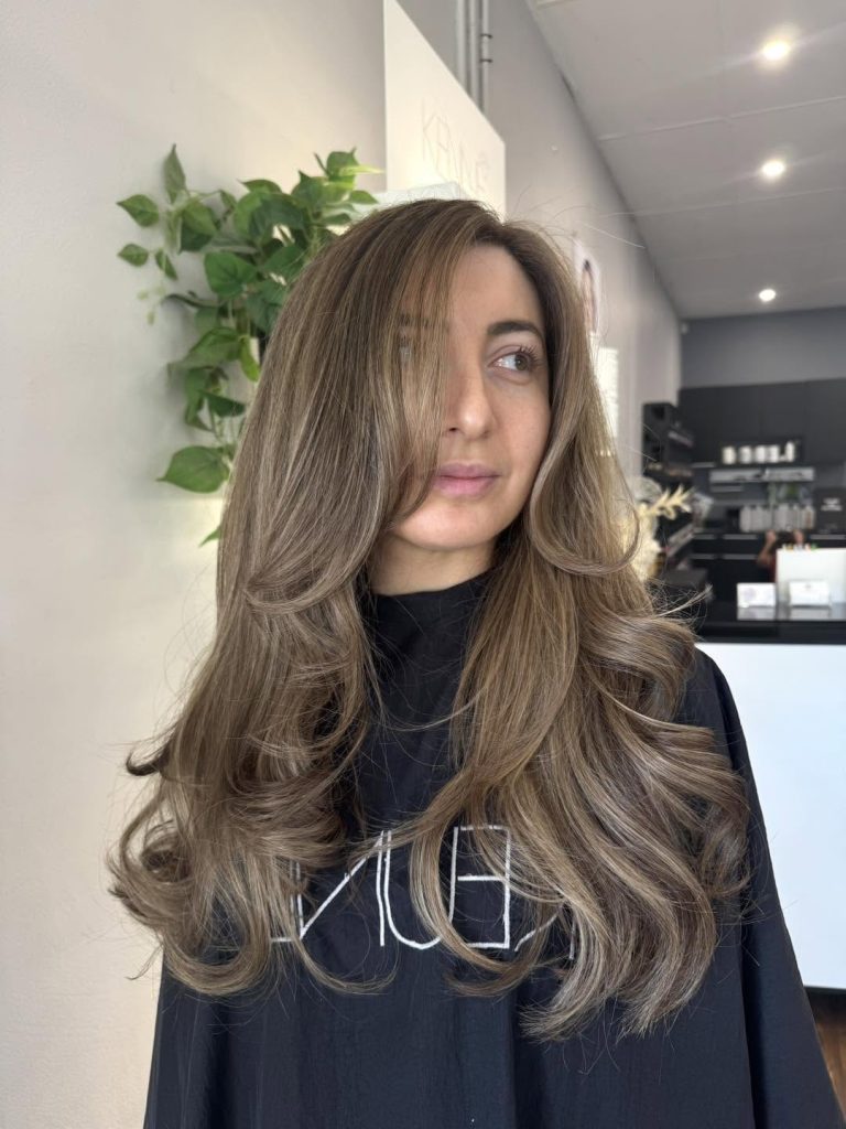 Long dimensional brunette hairstyle at Hair Envy Wallacia
